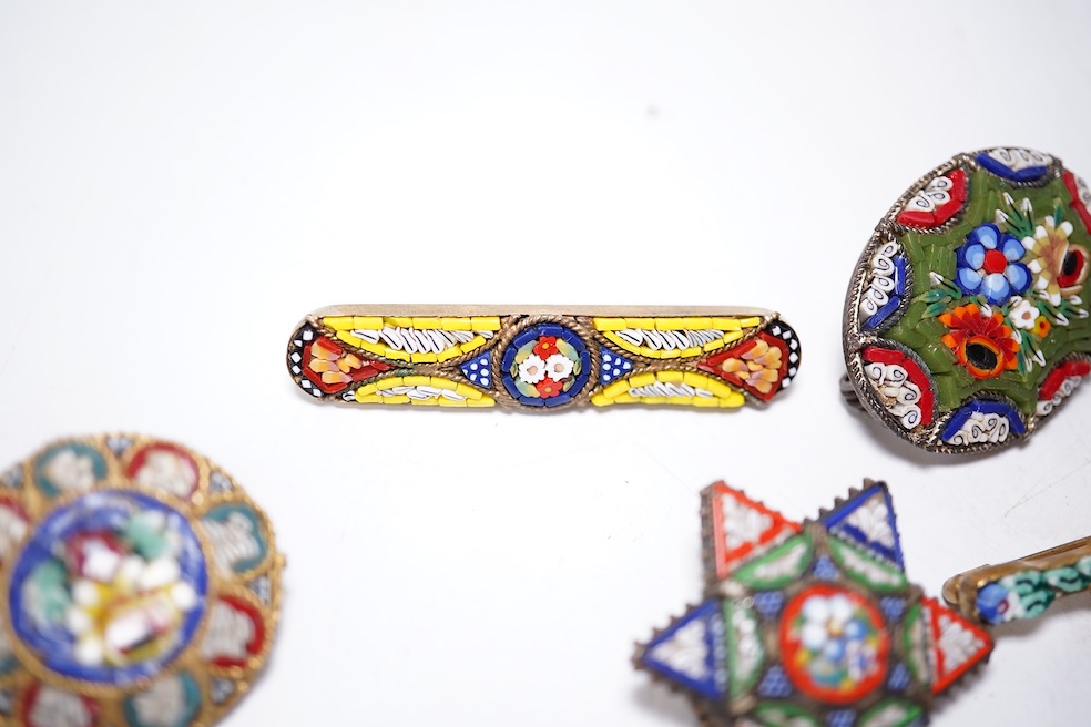 A collection of thirty-one micro-mosaic brooches, including fourteen mixed guitar and banjo shaped brooches, six large oval brooches and seven smaller brooches, three long brooches and a star shaped brooch. Condition - g